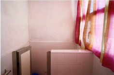 William Eggleston. UNTITLED (BATHROOM WITH PINK CURTAIN, CUBA)  2007.