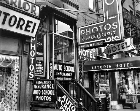 Brett Weston, Storefront Window and Signs, New York. 1943